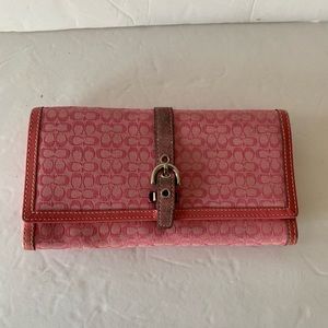 Coach pink color  canvas fabric wallet in perfect condition .